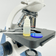Microscopio-NewOptics-NW126T-VisaoLateralAjusteFoco-PlatinaMovel